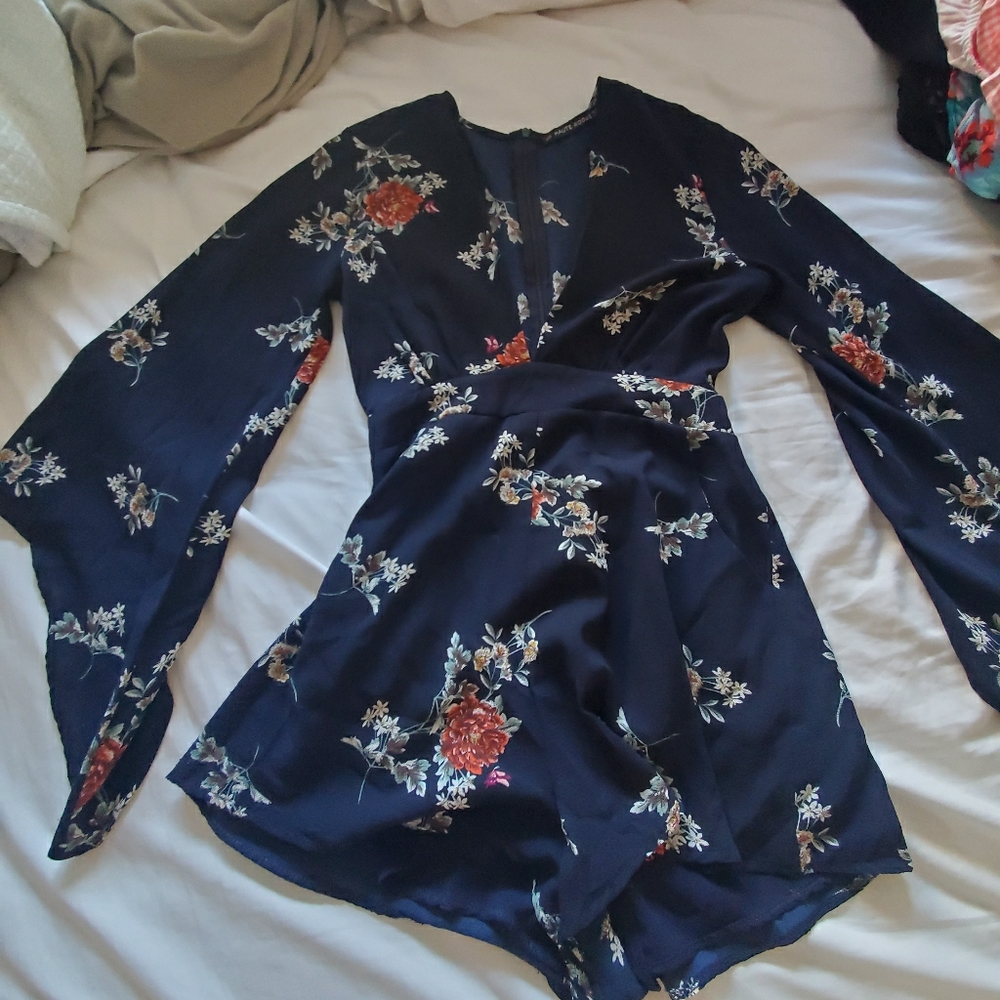 Long sleeved romper with fluted sleeve